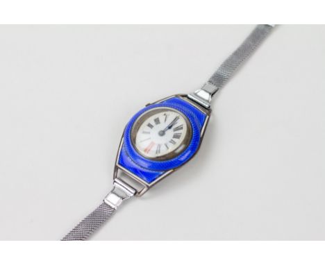 AN ART DECO FRENCH WHITE METAL AND BLUE ENAMEL LADIES WRIST WATCH the enamelled dial with arabic numerals, overall 3cm x 4cm 