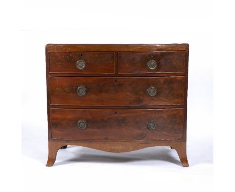 A 19TH CENTURY AND LATER MAHOGANY BOW FRONTED CHEST OF TWO SHORT AND TWO LONG DRAWERS with later ring handles and standing on