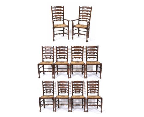 A SET OF TEN OAK AND ASH LADDER BACK DINING CHAIRS with turned stretchers to the front legs and rush upholstered seats, the c