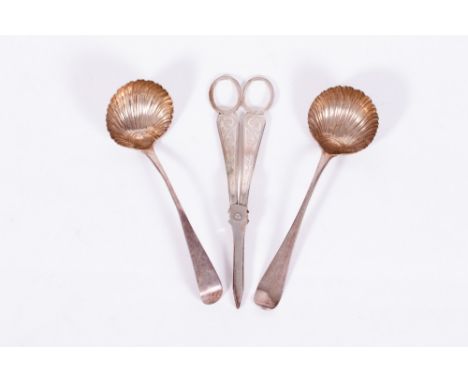 TWO 18TH CENTURY SILVER LADLES with scallop shell bowls and makers mark GB, possibly George Baskerville, each 18cm in length 
