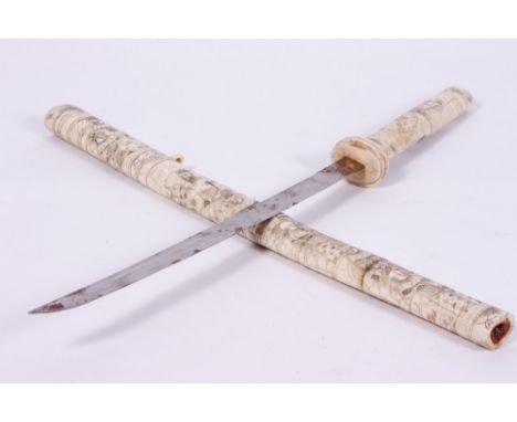 A JAPANESE SWORD  with a carved bone grip and scabbard, blade 41cm in length, overall 76cm in length Condition: top missing t