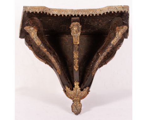 A 19TH CENTURY BOULLE STYLE BRACKET with cast ornament including masks, 42cm wide x 23cm deep x 40cm high Condition: in need 
