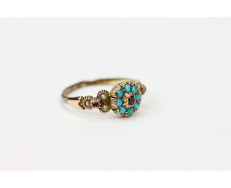 A VICTORIAN TURQUOISE, RUBY AND PEARL INSET YELLOW METAL RING the ring 19mm diameter Condition: surface scratches to the rubi