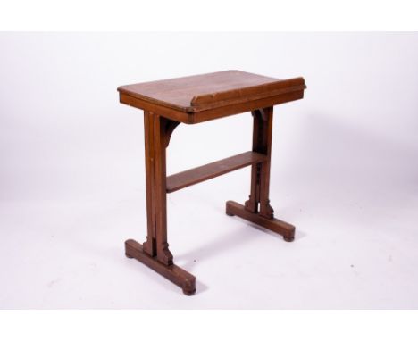 A 19TH CENTURY HARDWOOD ARCHITECTS OR DRAUGHTMANS TABLE with pivoting surface and rising mechanism, all standing on bun feet,