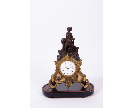 A 19TH CENTURY TIN SPELTER AND GILT METAL MANTLE TIMEPIECE the case surmounted by a Scottish highlander, the enamel dial with