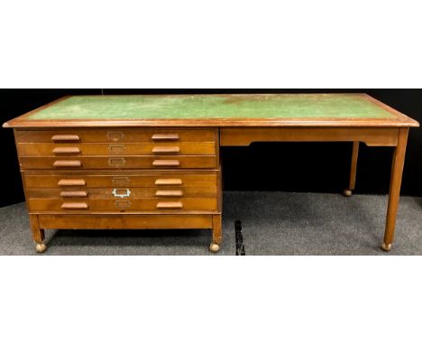 An ‘Abbess’ draughtsmans oak desk, six plan drawers to left side, sectional construction, 83cm high x 229cm wide x 86cm deep.