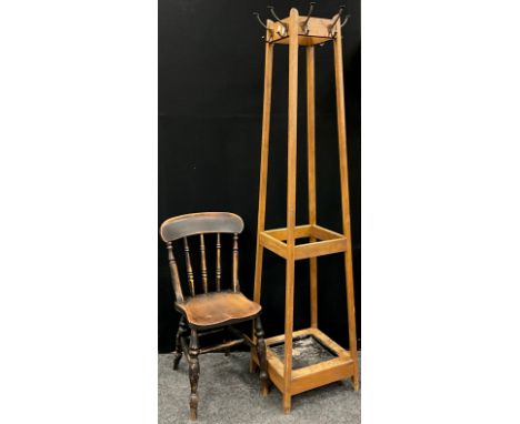 An early 20th century oak coat, hat and stick stand, of tapering square form, with metal drip-tray to base, 184cm high x 43cm