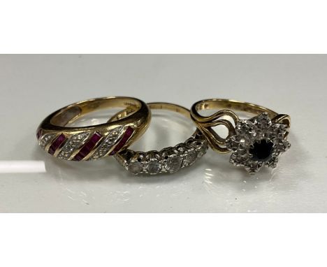jewellery - a ruby and diamond ring, set with square cut rubies and round cut diamond accents, 9ct gold shank, size N, an sap