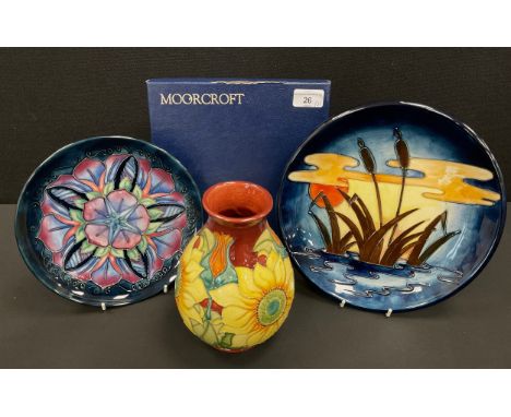 A Moorcroft Year plate, limited edition, 356/500, conforming certificate, ‘Bullrush sun set’ pattern plate, 26cm dia, ‘Inca’ 