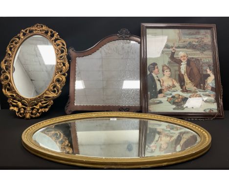 A 1950s E Gomme Furniture Wycombe oval gilt framed wall mirror, bacchanalian cherubs and scrolling foliate, 67cm x 46cm, anot