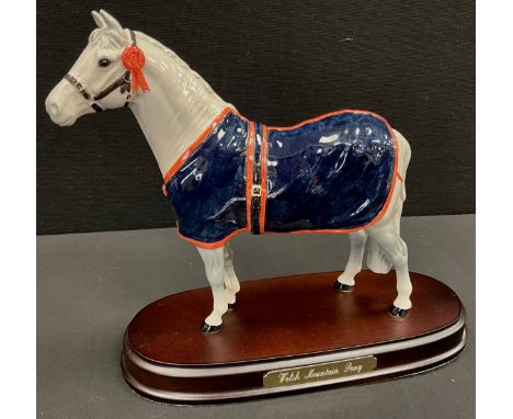 A Beswick (Royal Doulton) Welsh Mountain Pony, A247, wooden base.