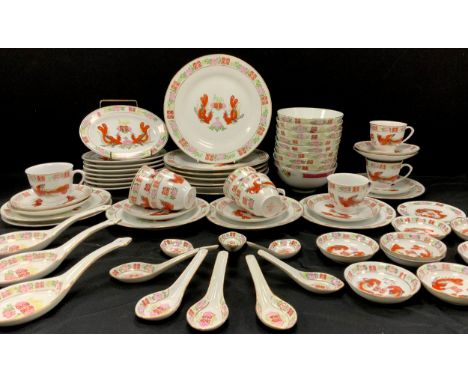 A Chinese table service for six, decorated with a pair of phoenix’s in the famille rose taste including; seven dinner plates,