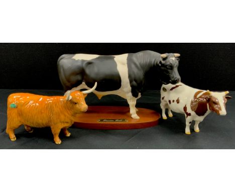 Beswick cows including; Friesian Bull on wooden plinth, 20cm high, Highland cow, no.1740, Ayrshire Bull (3)