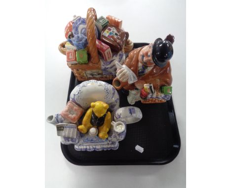 A tray containing three novelty Ringtons teapots, Monty Basket Teapot No. 1530 of 17,500, Morris Delivery Man No. 849 of 7,50
