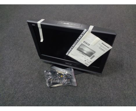 A Panasonic Viera 26 inch LCD TV with remote together with a further box containing assorted telephones, rechargeable light, 