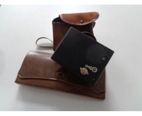 A cased vintage Kodak portrait hawk eye No. 2 camera together with a brown leather clutch bag (AF) 