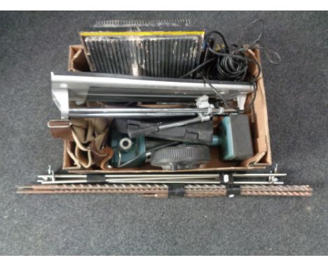 A box containing tile cutters, extension leads, carpet fitter, large drill pieces etc  