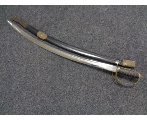 An Indian brass handled sword in scabbard  