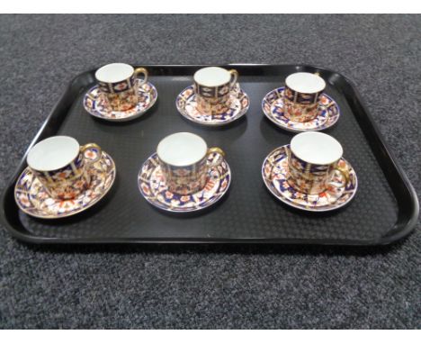 A tray containing three Royal Crown Derby Imari pattern cups and saucers 