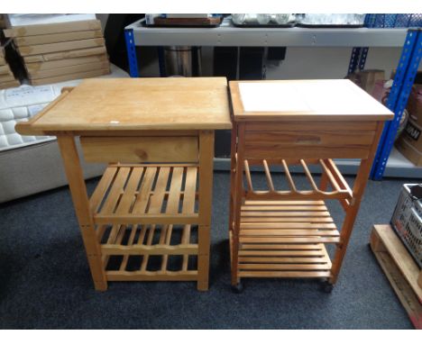 A pine tile top kitchen trolley with wine rack and shelves beneath, together with a further contemporary butcher's block styl