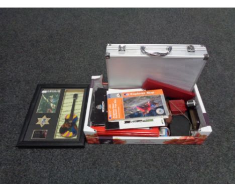 A box containing early 21st century Newcastle United programmes, Broons annuals, aluminium cased golf gift set, assorted wris