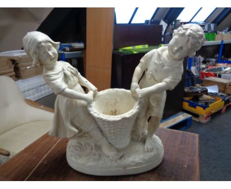 A twentieth century chalk planter modelled as a girl and boy with wicker basket, No. 621, and a simplex poss stick 