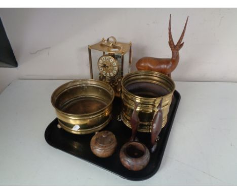 A tray containing a brass cased Kundo anniversary clock, two brass planters on raised feet together with treen animals and po