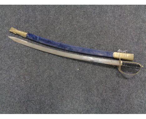 An Indian brass handled sword in scabbard 