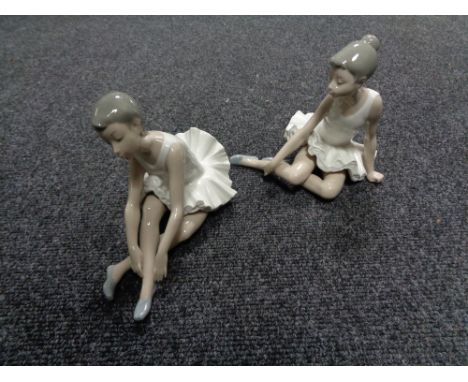 Two Nao figures, seated ballerinas 