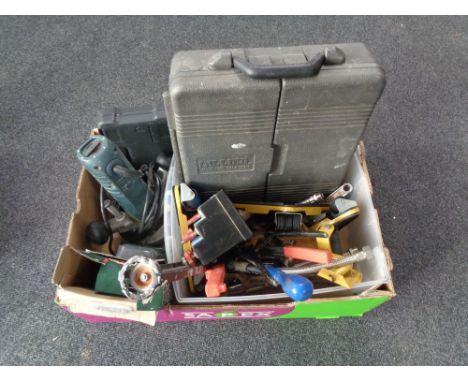 A box containing Black and Decker router bits, hand tools, case tool set, Bosch compact drill with battery 