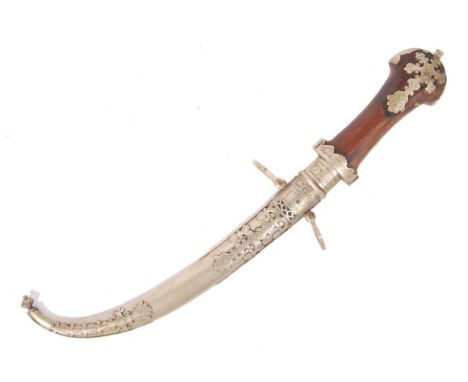 A 19th century Berber / Moroccan Jambiya dagger and scabbard , the white metal dagger having chased decoration and the knife 