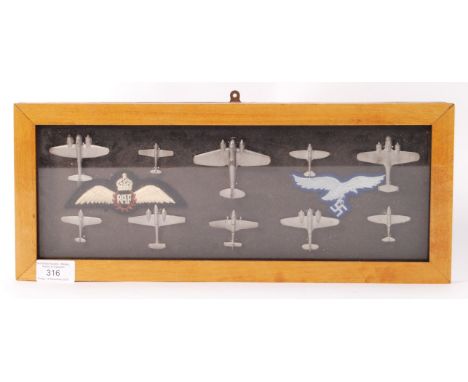 A 20th century ' Battle Of Britain ' inspired model display - comprising of white metal diecast models of British and German 