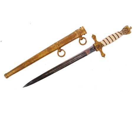 A WWII Second World War German Kriegsmarine Navy dagger. With engraved blade, and gilded brass scabbard and mounts, eagle pom