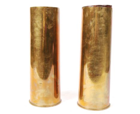 A pair of WWII Second World War brass drill artillery training cartridges / shells, each containing 3 leather charge bags and