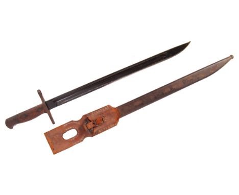 An antique 1897 pattern Japanese Arisaka rifle bayonet. Wooden grips, with Kokura mark to ricasso. Within its original steel 