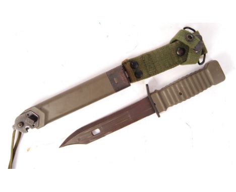 A 20th century short rifle bayonet - likely for an AK47. Green steel scabbard, with cutter end present. No makers marks. Meas