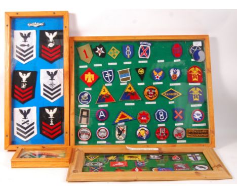 A collection of 4 x framed and glazed reproduction military army patches backed onto felt to include; British Navy rank patch
