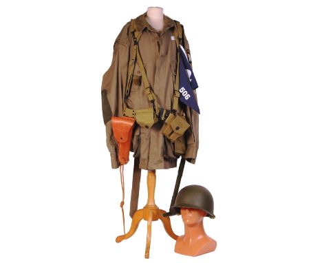 A WWII Second World War US Airborne Troops D-Day uniform display. Comprising of a battledress jacket, ' clicker ', knife, web