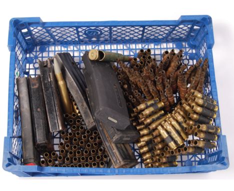 A collection of assorted 20th century spent ammunition casings and magazines to include; 3x bandoliers, several dummy / pract