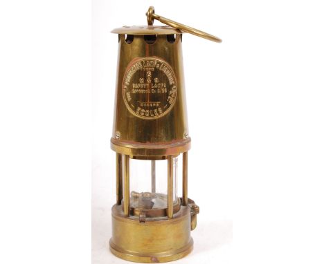 An antique / vintage 20th century brass Eccles miner's lamp. Embossed 'Protector Lamp &amp; Lighting Type 6 M &amp; Q Safety 
