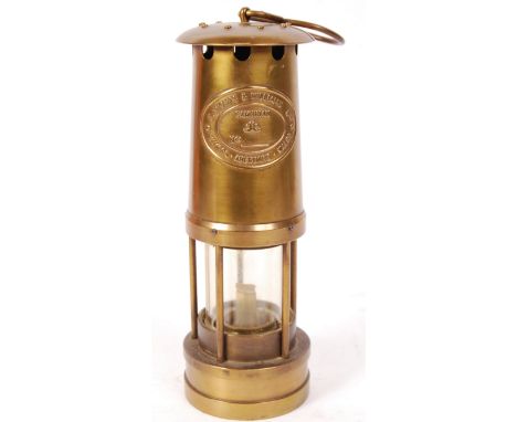 An antique / vintage 20th century Welsh miner's lamp by E Thomas & Williams Aberdale. Cambrian No.131525. Measures 26cm high.