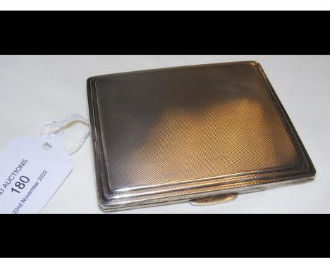 An engine turned silver cigarette case 