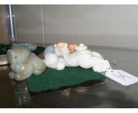A carved jade mythical beast - 10cms long, together with one other 5cms long