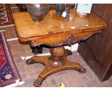 A 19th century walnut card table on bulbous column