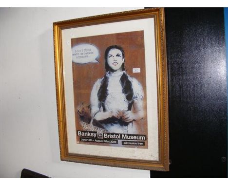 A Banksy vs British Museum 2009 print depicting Dorothy and Toto from The Wizard of Oz, framed and glazed