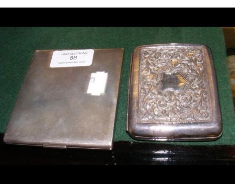 A silver engine turned cigarette case, together with a white metal cigarette case 