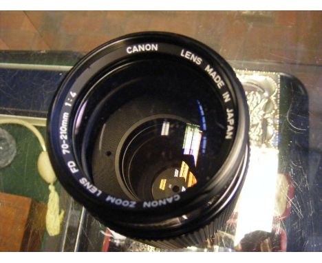 A vintage Canon AE-1 Camera, together with strap and lens CONDITION REPORTlenses are 50mm, 70-210 zoom (both canon)Condition 