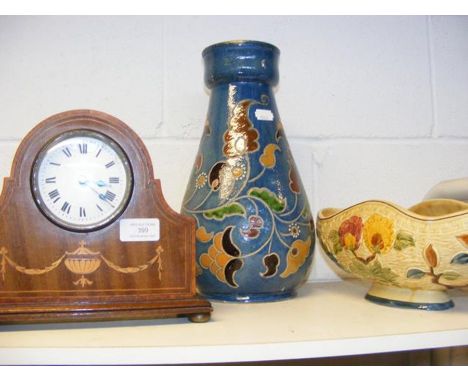 A mahogany mantel clock, together with a brightly painted vase and pot pourri bowl 