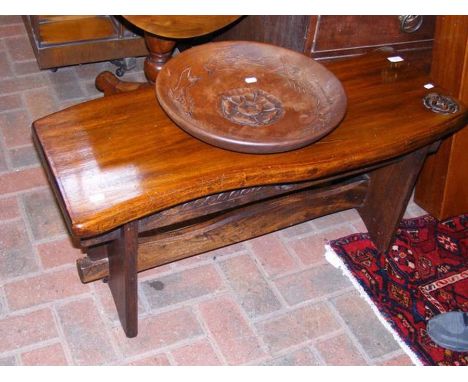 A carved hardwood bench with Tudor Rose design together with a hardwood bowl with similar carving by Harry Tomkin