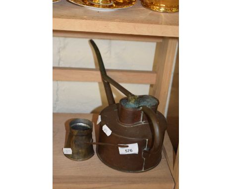 Vintage watering can and tasting cup